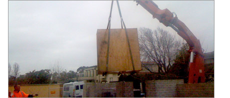 Aquarium being lowereded into position by a crane