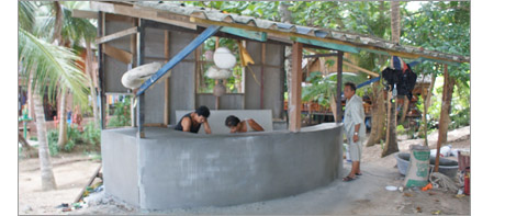 local people collecting materials for the resort aquarium